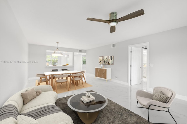 12500 SW 6th St Unit 206N, Pembroke Pines, FL 33027 - living area featuring light marble finish floors and a ceiling fan