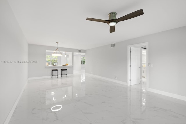 12500 SW 6th St Unit 206N, Pembroke Pines, FL 33027 - spare room featuring light marble finish flooring and a ceiling fan