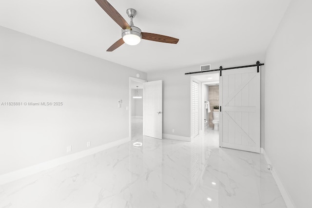12500 SW 6th St Unit 206N, Pembroke Pines, FL 33027 - unfurnished bedroom featuring marble tiled floors, a barn door, ensuite bath, and a ceiling fan