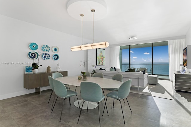 10203 Collins Ave Unit 1003, Bal Harbour, FL 33154 - dining area with concrete flooring and a water view