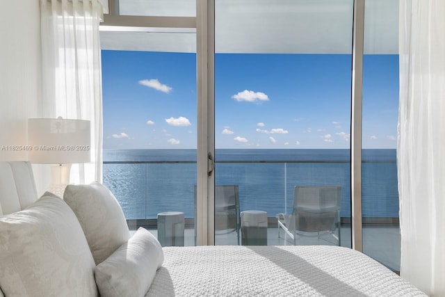 10203 Collins Ave Unit 1003, Bal Harbour, FL 33154 - bedroom featuring a water view