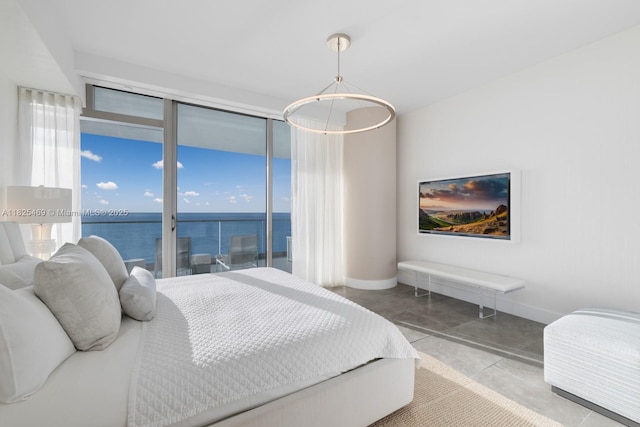 10203 Collins Ave Unit 1003, Bal Harbour, FL 33154 - bedroom with access to outside and concrete floors