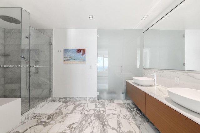 10203 Collins Ave Unit 1003, Bal Harbour, FL 33154 - bathroom featuring a marble finish shower, double vanity, and marble finish floors