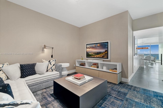 10203 Collins Ave Unit 1003, Bal Harbour, FL 33154 - living room featuring baseboards