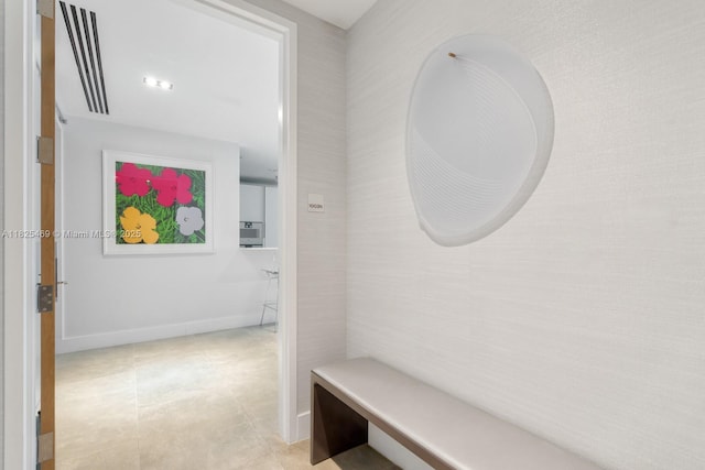 10203 Collins Ave Unit 1003, Bal Harbour, FL 33154 - mudroom featuring baseboards and light tile patterned flooring