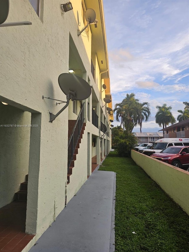 1521 W 42nd Pl Unit 18, Hialeah, FL 33012 - view of property with uncovered parking and stairs