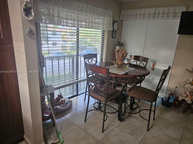 1521 W 42nd Pl Unit 18, Hialeah, FL 33012 - dining room with tile patterned flooring and healthy amount of natural light