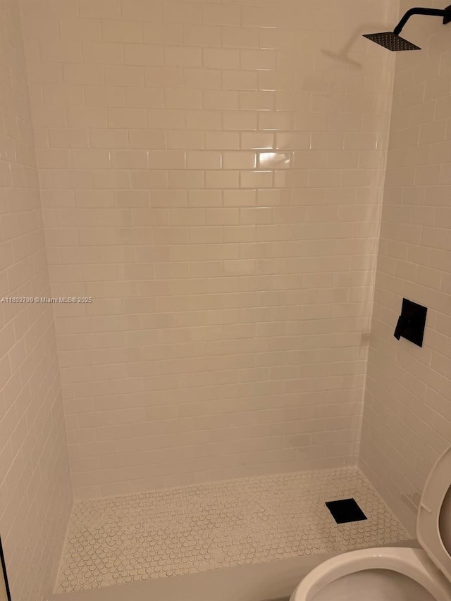 2341 W 66th Pl Unit 103, Hialeah, FL 33016 - bathroom featuring toilet and a tile shower