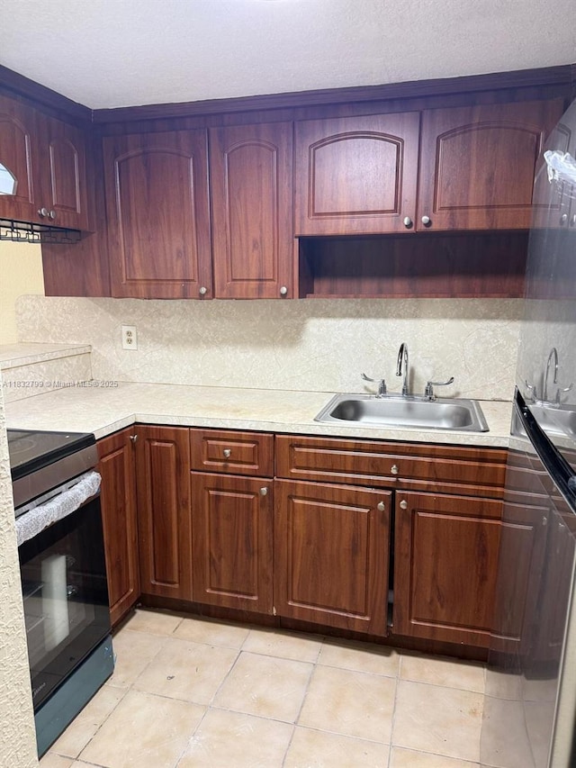 2341 W 66th Pl Unit 103, Hialeah, FL 33016 - kitchen featuring stainless steel electric range, light countertops, backsplash, and light tile patterned floors