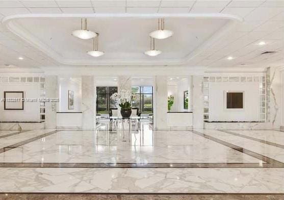 5700 Collins Ave Unit 6J, Miami Beach, FL 33140 - building lobby with ornamental molding and recessed lighting