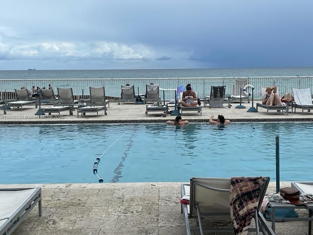 19201 Collins Ave Unit 717, Sunny Isles Beach, FL 33160 - community pool featuring a water view and a patio