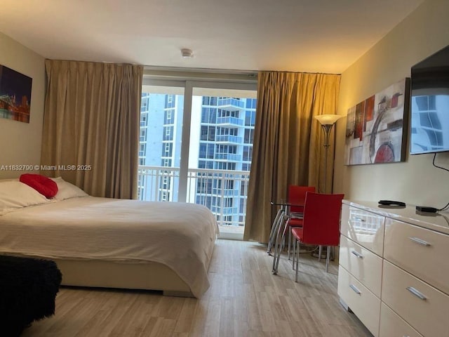 19201 Collins Ave Unit 717, Sunny Isles Beach, FL 33160 - bedroom with access to outside and light wood finished floors