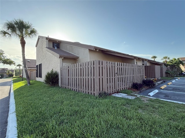 1965 SW 81st Way, Davie, FL 33324 - view of side of property with uncovered parking and stucco siding