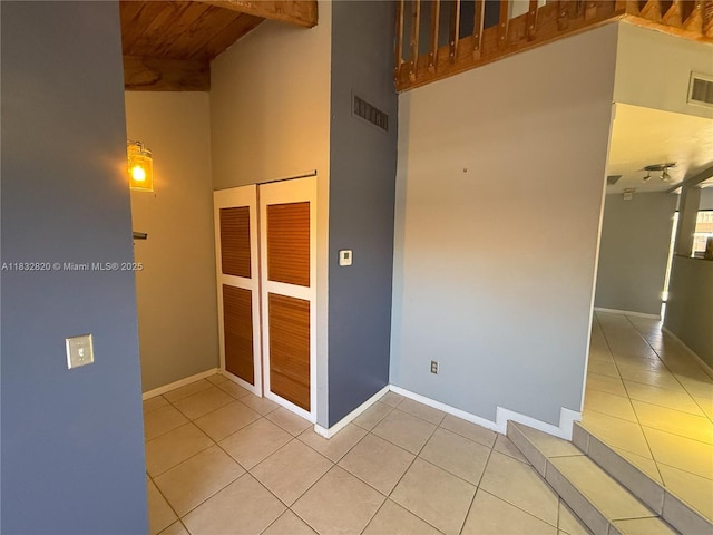 1965 SW 81st Way, Davie, FL 33324 - unfurnished room featuring a high ceiling, light tile patterned flooring, and a wood ceiling with exposed beams