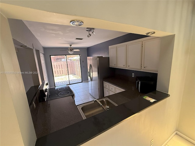 1965 SW 81st Way, Davie, FL 33324 - kitchen featuring dark countertops, electric range, stainless steel fridge with ice dispenser, white cabinets, and ceiling fan