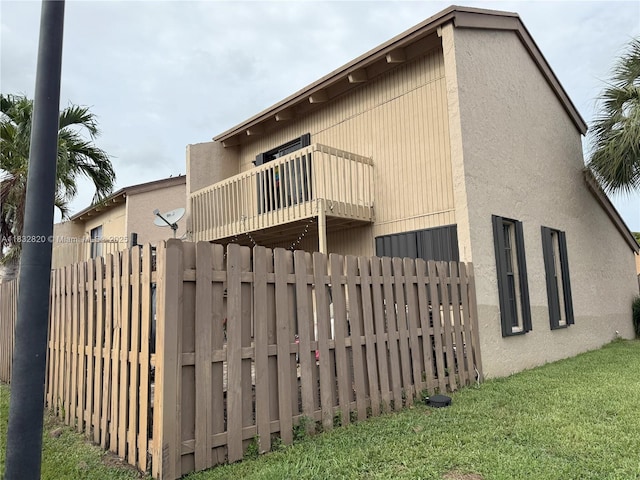 1965 SW 81st Way, Davie, FL 33324 - rear view of property featuring a balcony and stucco siding