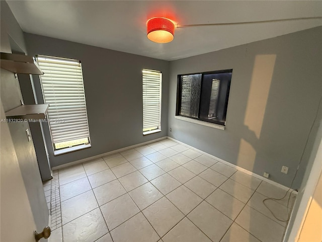 1965 SW 81st Way, Davie, FL 33324 - empty room with light tile patterned floors and baseboards