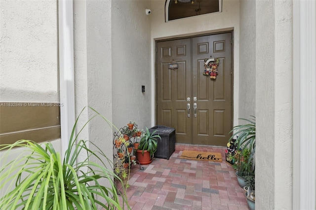 14842 SW 22nd Ter, Miami, FL 33185 - property entrance with stucco siding and a security system