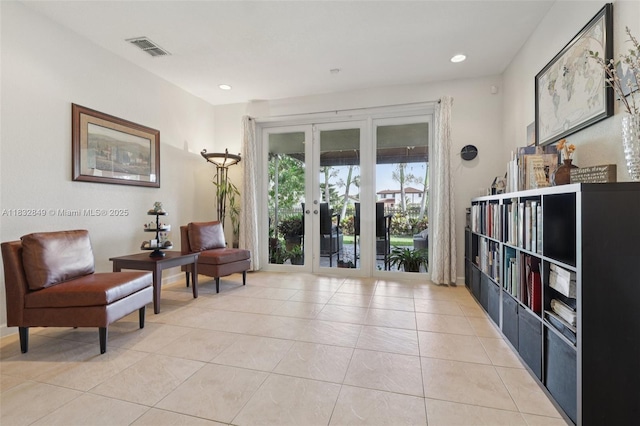 14842 SW 22nd Ter, Miami, FL 33185 - living area with french doors, light tile patterned floors, and recessed lighting