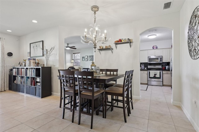 14842 SW 22nd Ter, Miami, FL 33185 - dining space featuring arched walkways, light tile patterned floors, ceiling fan, a chandelier, and recessed lighting