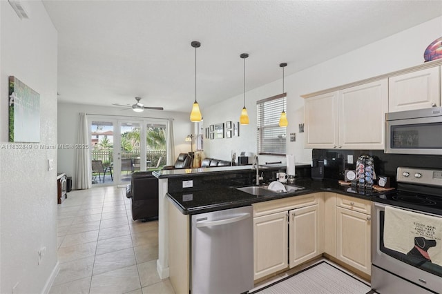 14842 SW 22nd Ter, Miami, FL 33185 - kitchen with appliances with stainless steel finishes, open floor plan, a peninsula, pendant lighting, and ceiling fan
