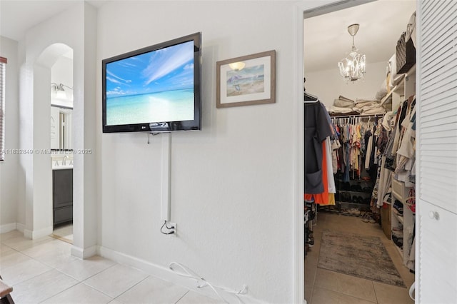 14842 SW 22nd Ter, Miami, FL 33185 - bathroom with vanity, tile patterned flooring, a chandelier, and a walk in closet
