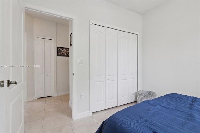 14842 SW 22nd Ter, Miami, FL 33185 - bedroom with light tile patterned floors and a closet