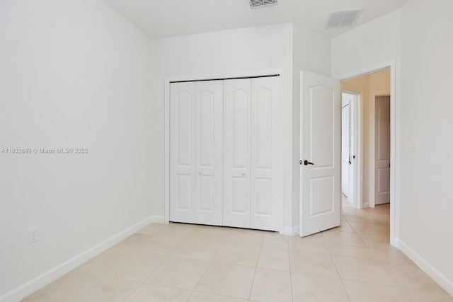 14842 SW 22nd Ter, Miami, FL 33185 - unfurnished bedroom featuring light tile patterned floors and a closet