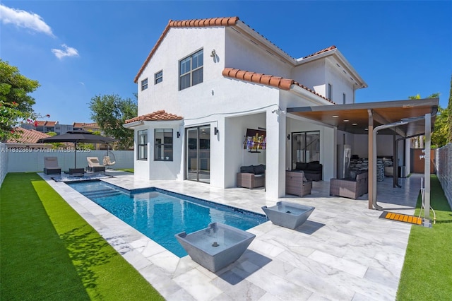 1005 NW 100th Ave, Miami, FL 33172 - back of house featuring an outdoor hangout area, a tile roof, a fenced backyard, and stucco siding
