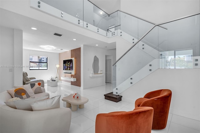 1005 NW 100th Ave, Miami, FL 33172 - tiled living area featuring recessed lighting, stairway, and a towering ceiling