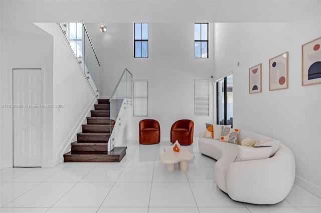 1005 NW 100th Ave, Miami, FL 33172 - tiled living area featuring stairs and a towering ceiling