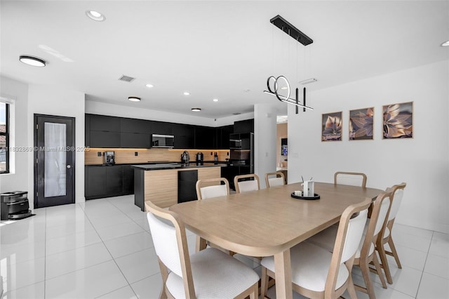 1005 NW 100th Ave, Miami, FL 33172 - dining area with light tile patterned floors and recessed lighting