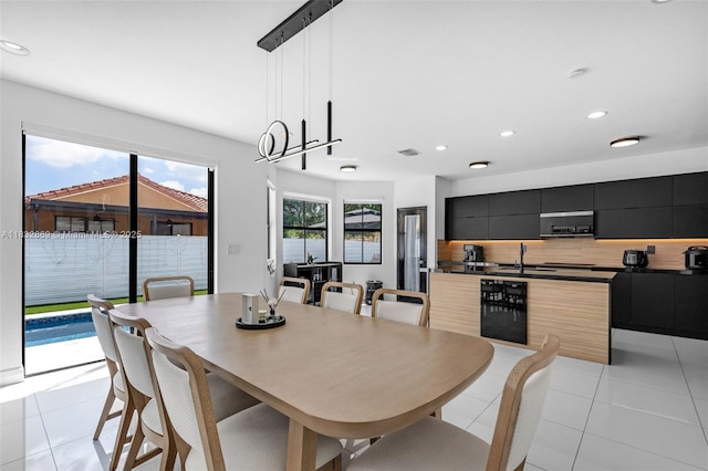 1005 NW 100th Ave, Miami, FL 33172 - dining space with light tile patterned flooring and recessed lighting