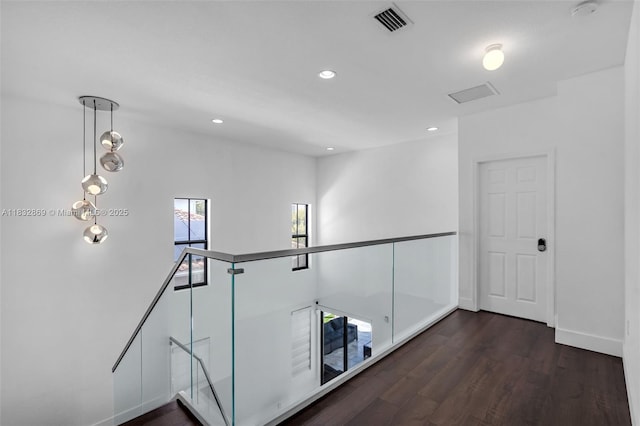 1005 NW 100th Ave, Miami, FL 33172 - corridor featuring dark wood-type flooring, an upstairs landing, and recessed lighting