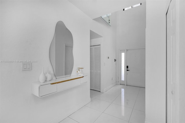 1005 NW 100th Ave, Miami, FL 33172 - entryway featuring baseboards and light tile patterned flooring