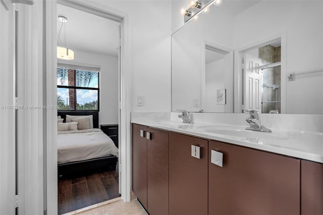 1005 NW 100th Ave, Miami, FL 33172 - full bathroom with double vanity, a shower stall, and connected bathroom