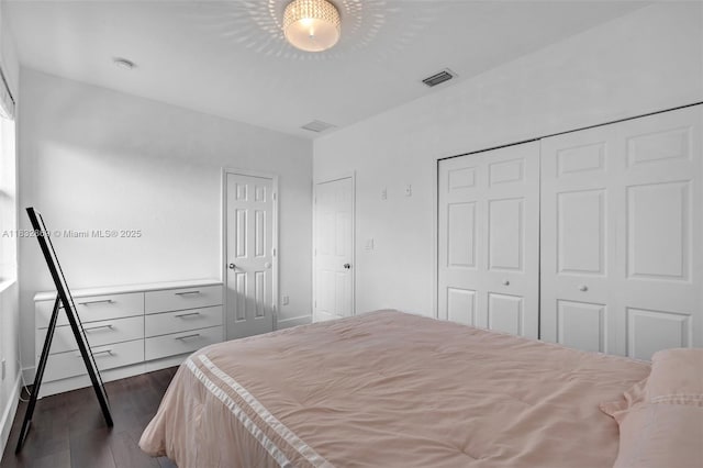 1005 NW 100th Ave, Miami, FL 33172 - bedroom with dark wood-style flooring and a closet