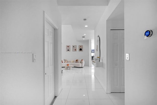 1005 NW 100th Ave, Miami, FL 33172 - hall featuring light tile patterned flooring and recessed lighting