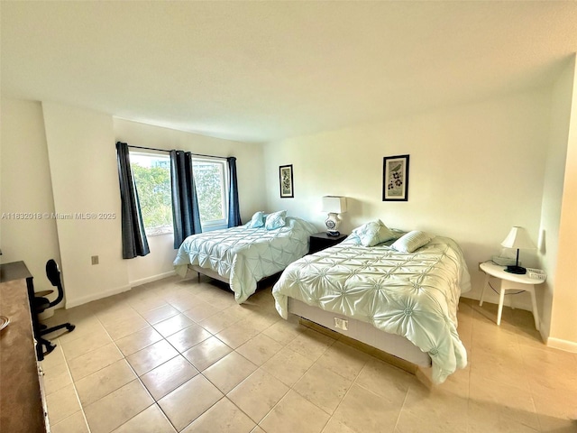 200 178th Dr Unit 409, Sunny Isles Beach, FL 33160 - bedroom with light tile patterned flooring and baseboards
