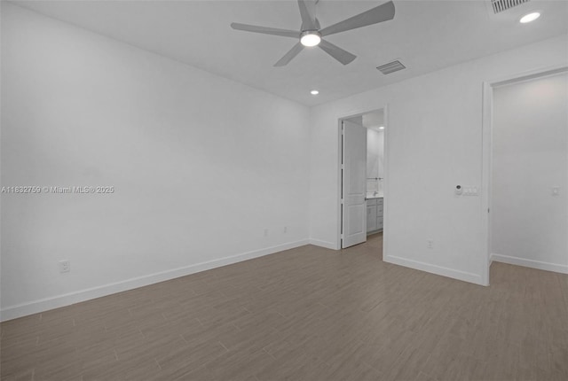 14549 Bretton Woods Trce, Delray Beach, FL 33446 - unfurnished bedroom with wood finished floors, ensuite bath, ceiling fan, recessed lighting, and a walk in closet