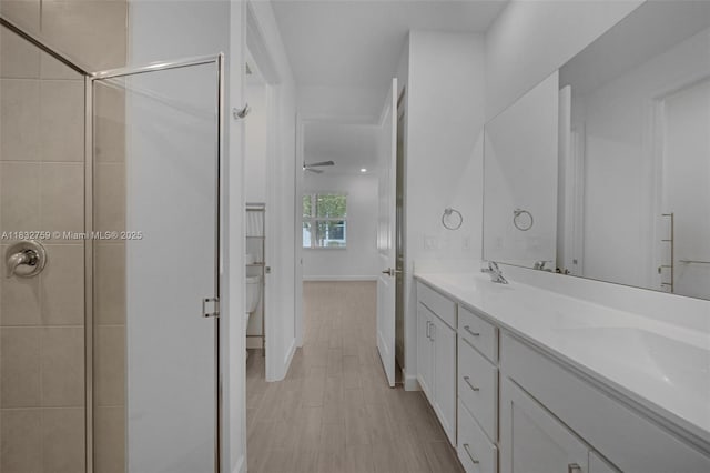 14549 Bretton Woods Trce, Delray Beach, FL 33446 - bathroom with a stall shower, double vanity, and ceiling fan