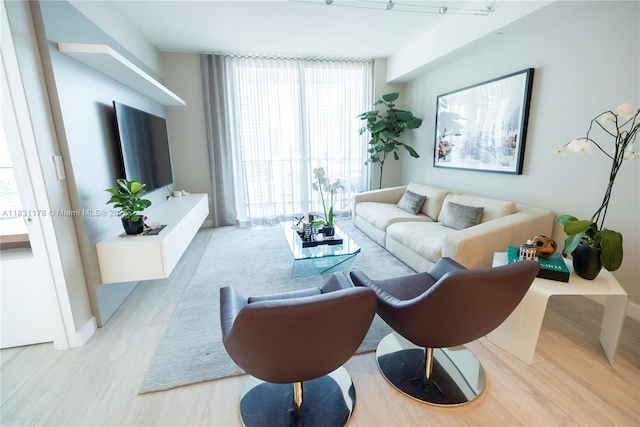 45 SW 9th St Unit 1705, Miami, FL 33130 - living room with light wood-style flooring and floor to ceiling windows