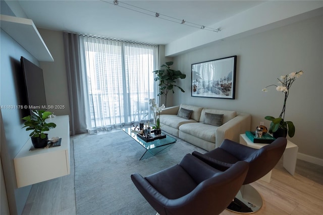 45 SW 9th St Unit 1705, Miami, FL 33130 - living room featuring wood finished floors and baseboards