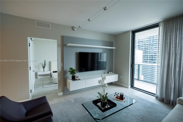 45 SW 9th St Unit 1705, Miami, FL 33130 - living area with light wood finished floors and a wall of windows