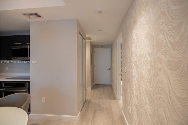 45 SW 9th St Unit 1705, Miami, FL 33130 - hall with wallpapered walls and light wood-style flooring