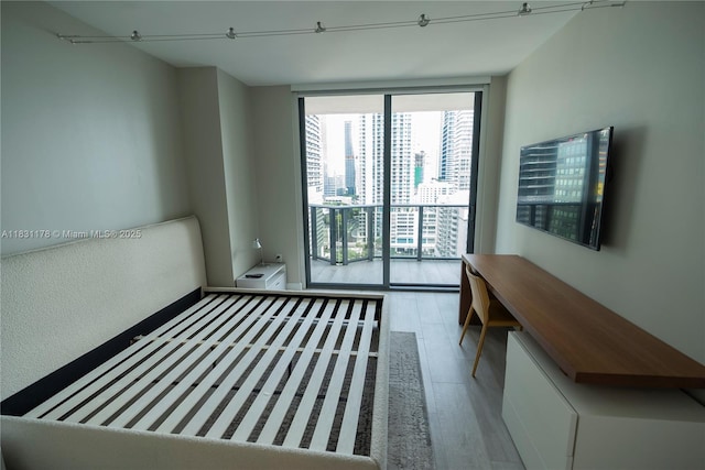 45 SW 9th St Unit 1705, Miami, FL 33130 - spare room featuring floor to ceiling windows and wood finished floors