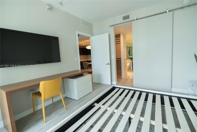 45 SW 9th St Unit 1705, Miami, FL 33130 - unfurnished bedroom with light wood-style flooring and baseboards