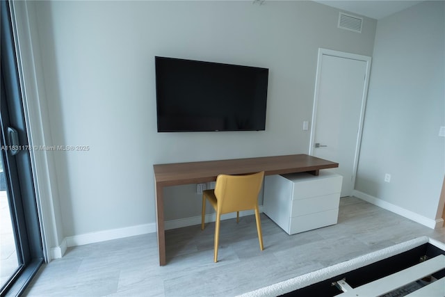 45 SW 9th St Unit 1705, Miami, FL 33130 - office area featuring wood finished floors and baseboards