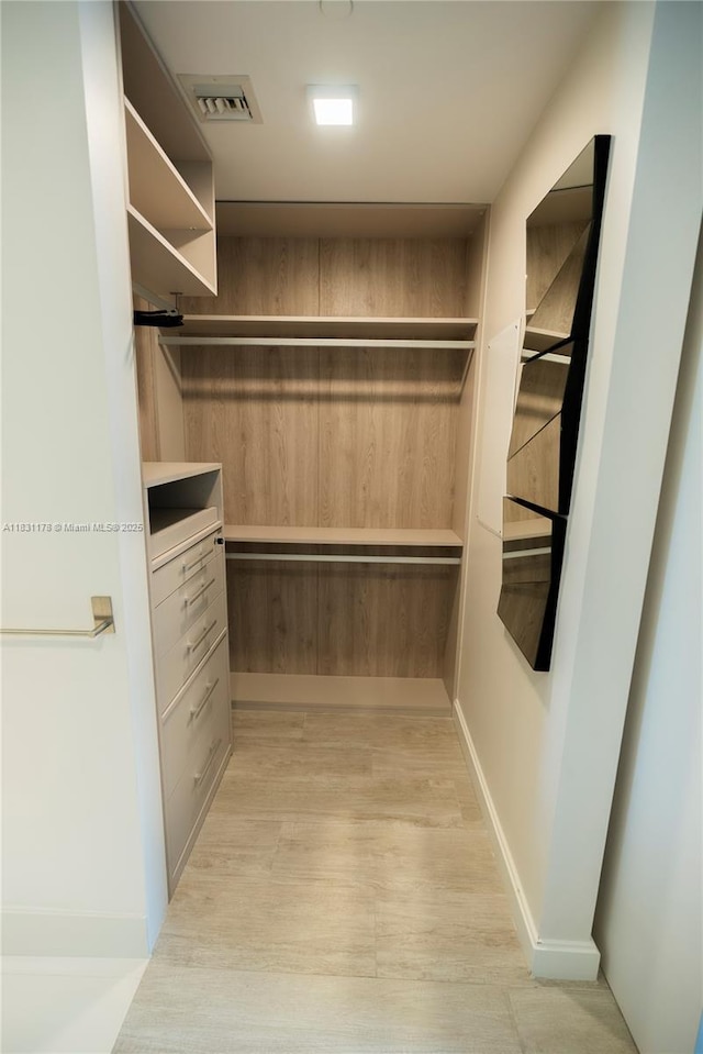 45 SW 9th St Unit 1705, Miami, FL 33130 - walk in closet with light wood finished floors