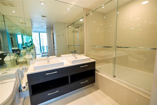 45 SW 9th St Unit 1705, Miami, FL 33130 - bathroom featuring double vanity, enclosed tub / shower combo, and tile patterned floors